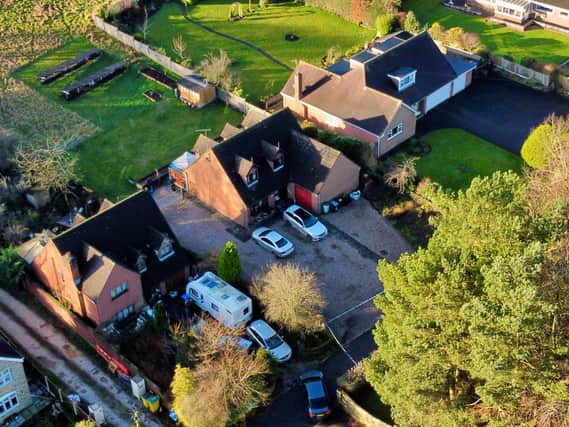 A view of a police tent in the garden of a property (centre) in Park Lane, Cheadle, Staffordshire, where two women were found dead on New Year's Eve Picture: Peter Byrne/PA Wire
