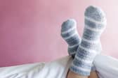 Wearing socks to bed might be comfy - but what else are you bringing into bed with them? (Picture: Adobe Stock)