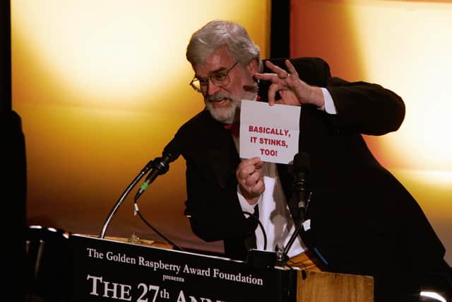 Presenter John Wilson announces the winner for  "Worst Picture",  "Basic Instinct 2" announced as "Basically it Stinks Too" during the Razzie Awards in Hollywood, CA, 24 February 2007. (Credit: AFP PHOTO / HECTOR MATA)