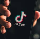 17 slang TikTok terms, including abbreviations and acronyms, explained including moots, OOMF, 1437 and bussin. Stock image by Adobe Photos.