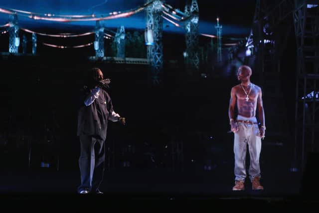 Rapper Snoop Dogg and a hologram of deceased rapper Tupac Shakur perform onstage during day 3 of the Coachella in 2012 (Christopher Polk/Getty Images for Coachella)