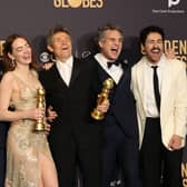(L-R) Yorgos Lanthimos, Emma Stone, Willem Dafoe, Mark Ruffalo, and Ramy Youssef, winners of the Best Picture, Musical or Comedy award for 'Poor Things' pose in the press room during the 81st Annual Golden Globe Awards (Photo: Amy Sussman/Getty Images)