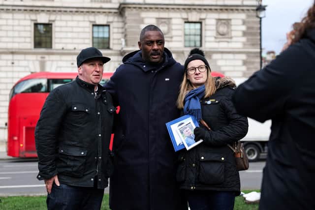 Idris Elba alongside the family of knife crime victims at the launch of his 'Don't Stop Your Future' campaign to ban machetes and zombie knifes. (Credit: Getty Images)