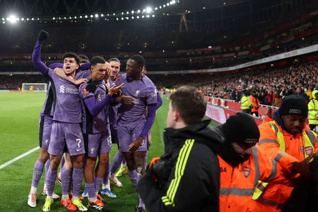 Liverpool celebrate their first goal, scored by Arsenal's Jakub Kiwior