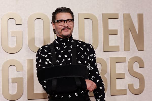 Despite the sling, Pedro Pascal looked incredibly dapper in a black and white Bottega Veneta shirt and black trousers. 

