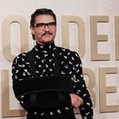 Despite the sling, Pedro Pascal looked incredibly dapper in a black and white Bottega Veneta shirt and black trousers. 

