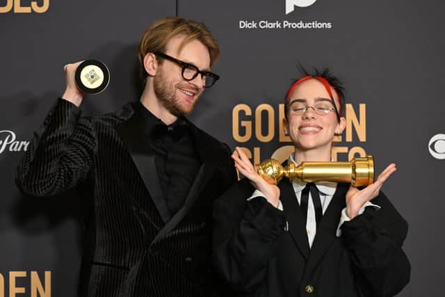 Musicians Billie Eilish and Finneas O'Connell pose with the award for Best Original Song - Motion Picture "What Was I Made For" from the movie "Barbie" in the press room during the 81st annual Golden Globe Awards at The Beverly Hilton hotel in Beverly Hills, California, on January 7, 2024. (Photo by Robyn BECK / AFP)