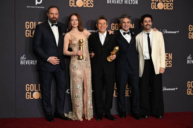 (From L) Greek director Yorgos Lanthimos, US actress Emma Stone, US actor Willem Dafoe, US actor Mark Ruffalo and US actor Ramy Youssef pose in the press room with the awards for Best Motion Picture - Musical or Comedy and Best Performance by a Female Actor in a Motion Picture - Drama  for "Poor Things" during the 81st annual Golden Globe Awards at The Beverly Hilton hotel in Beverly Hills, California, on January 7, 2024. (Photo by Robyn BECK / AFP)