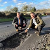 Councillor David Martin (left) and Jason Zadrozny (right) next to the huge pothole in Flatts Lane, Westwood 