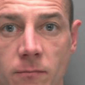 Nicholas Evans, 36, has been jailed just two days after he made extreme comments towards a teenager at Llandudno Junction railway station. (Credit: British Transport Police)