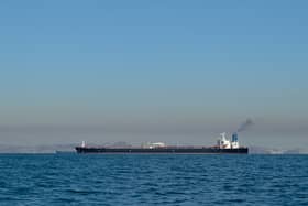Large oil tanker ship smoking sails Strait of Hormuz, Persian Gulf, Iran. Picture: Getty images