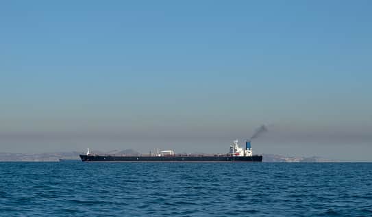 Large oil tanker ship smoking sails Strait of Hormuz, Persian Gulf, Iran (Stock Getty image)