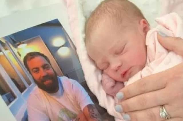 Baby Alice-Rose Adam Hurst with a photo of her father, Adam Hurst. (Picture: Irwin Mitchell/SWNS)
