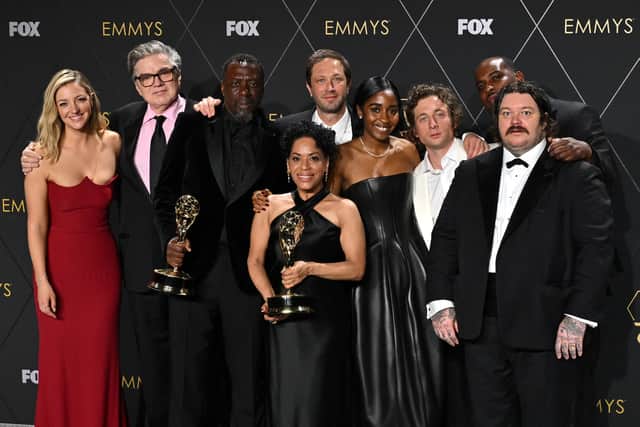 Cast members of "The Bear", (from L) US actress Abby Elliott, US actor Oliver Platt, US actor Edwin Lee Gibson, US actress Liza Colon-Zayas, US actor Ebon Moss-Bachrach, US actress Ayo Edebiri, US actor Jeremy Allen White, US actor Lionel Boyce and Canadian chef and actor Matty Matheson, pose in the press room with the award for Outstanding Comedy Series during the 75th Emmy Awards at the Peacock Theatre at L.A. Live in Los Angeles on January 15, 2024. (Photo by Robyn BECK / AFP)