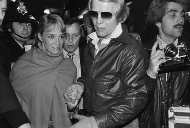 Footloose and Starsky & Hutch star Lynne Marta dies at 78 weeks after the death of her ex David Soul. American actors David Soul and Lynne Marta surrounded by photographers and police as they arrive at Heathrow Airport, London, UK in 1977. (Photo by John Minihan/Evening Standard/Hulton Archive/Getty Images)