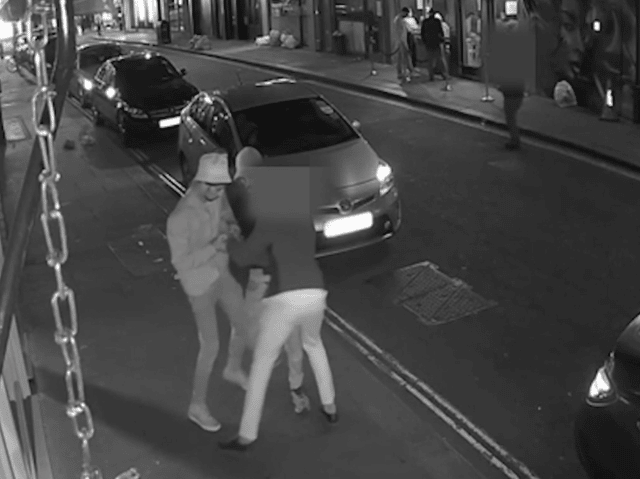 Met Police officers caught luxury watch robbers in the act in London's West End by going undercover and posing as members of the public wearing the expensive wristwear. Still of CCTV footage shows offenders trying to rob a police officer. Photo by Met Police.