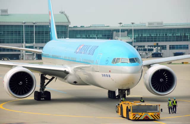 A Korean Air and Cathay Pacific plane collided into each other at New Chitose Airport in Japan leaving a hole in the wing. (Photo: AFP via Getty Images)