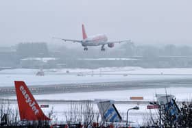 Can passengers get a refund if their flight is cancelled due to bad weather - we explain as UK record coldest night of winter so far. (Photo: AFP via Getty Images)
