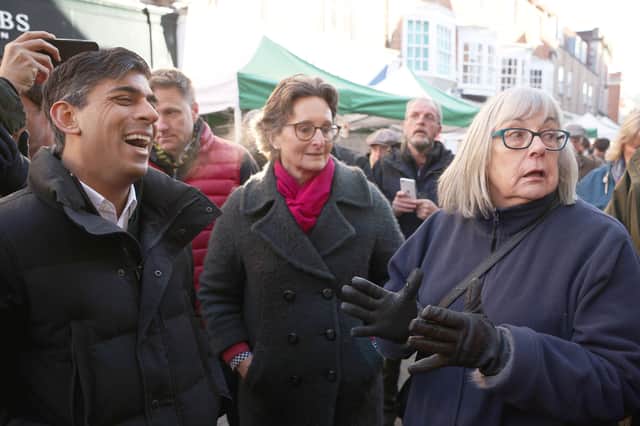 Rishi Sunak laughs as member of public asks about NHS. Credit: Dan Kitwood/PA Wire
