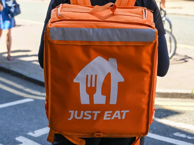 Online food order and delivery platform Just Eat Takeaway will close its in-house delivery service in a major city. Stock image by Adobe Photos.