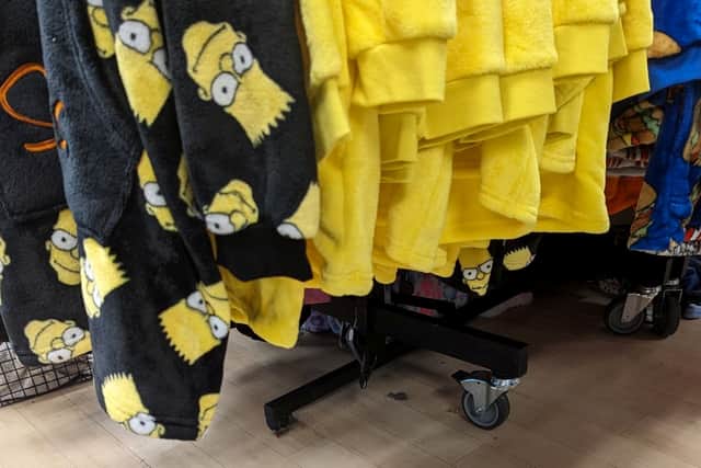 The cat was found under these Bart Simpson sweaters (Photo: RSPCA/SWNS)