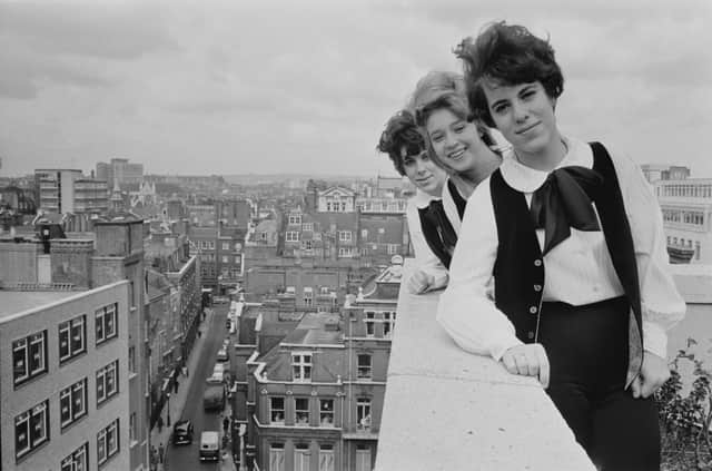 American pop girl group The Shangri-Las during a photo shoot on a terrace in London, UK, 24th October 1964; they are  Marguerite 'Marge' Ganser, Mary Weiss, and Mary Ann Ganser. (Photo by Daily Express/Hulton Archive/Getty Images)