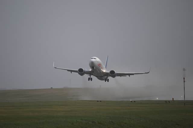 An updated list of affected departures and arrivals at airports including Edinburgh, Gatwick, and Heathrow as Met Office issues weather warnings. (Photo: AFP via Getty Images)