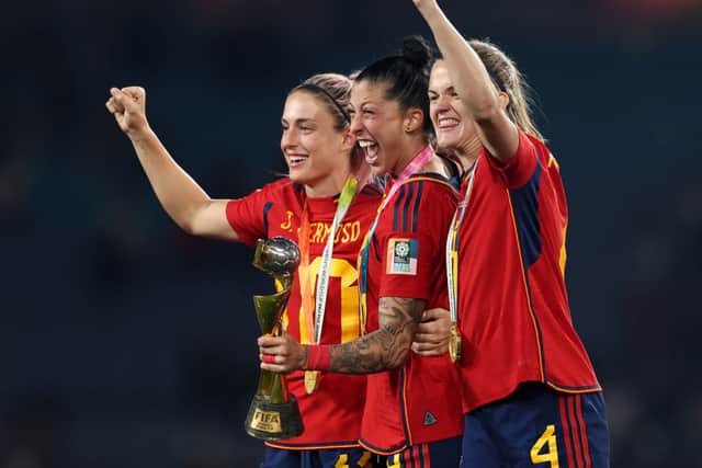Jenni Hermoso celebrates winning the World Cup with Alexia Putellas (L) and Irene Paredes (R)