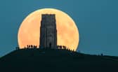 A supermoon rises behind Glastonbury Tor in 2015 (Photo: Matt Cardy/Getty Images)
