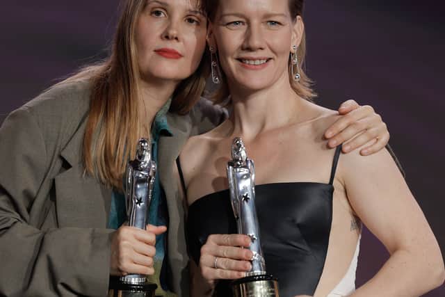 French director Justine Triet (L) and German actress Sandra Hueller pose with  their trophies for best "European director" and "Best actress" for their film "Anatomy of a Fall" during the 36th European Film Awards ceremony in Berlin, on December 9, 2023. (Photo by Odd ANDERSEN / AFP) 