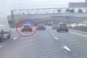Derbyshire Roads Policing officers released this video of  Volkswagen Scirocco undertaking on the M1 - but many motorists said that the 'lane-hogging' on display was worse 
Video: @DerbyshireRPU on X 