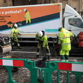 Roadworks are carried out and potholes are filled by workers in front of the Houses of Parliament. Picture: Jack Taylor/Getty Images