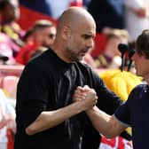Pep Guardiola and Thomas Frank prior to the Premier League match between Brentford and Manchester City in May 2023 (Photo: Mike Hewitt/Getty Images)