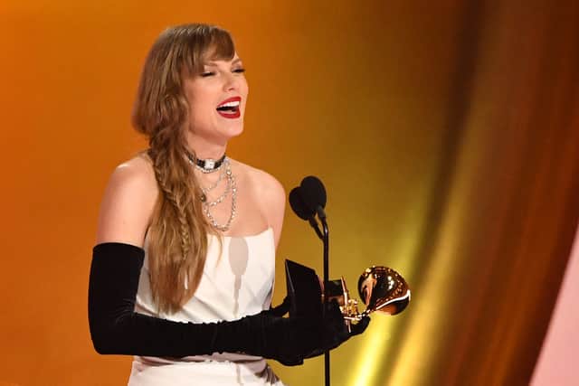 Pop megastar Taylor Swift celebrated her historic Grammy Award win by announcing a surprise new album. (Credit: AFP via Getty Images)