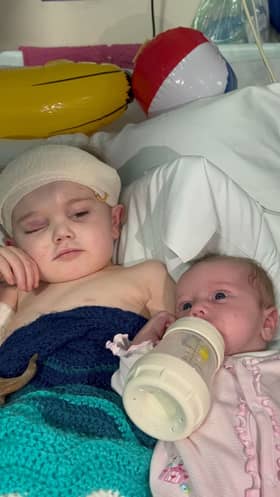 Tommy-Rae meets his baby sister Esmeralda. Picture: Express & Star