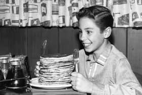 Child actor Johnny Crawford looks forward to eating a pile of pancakes (Photo: Keystone Features/Getty Images)