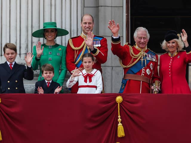 (L-R) Prince George of Wales, Britain's Catherine, Princess of Wales, Britain's Prince Louis of Wales, Britain's Prince William, Prince of Wales, Britain's Princess Charlotte of Wales, Britain's King Charles III and Britain's Queen Camilla. (Photo by Adrian DENNIS / AFP) (Photo by ADRIAN DENNIS/AFP via Getty Images)