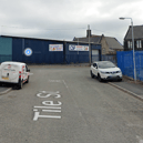 Two men have been arrested after a teenager died in a 'workplace accident' on an industrial estate on Tile Street,  Bury. 