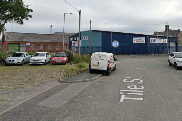 Two men have been arrested after a teenager died in a 'workplace accident' on an industrial estate on Tile Street,  Bury. 