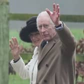 King Charles III and Queen Camilla wave to well wishers after attending a Sunday church service at St Mary Magdalene Church in Sandringham, Norfolk.