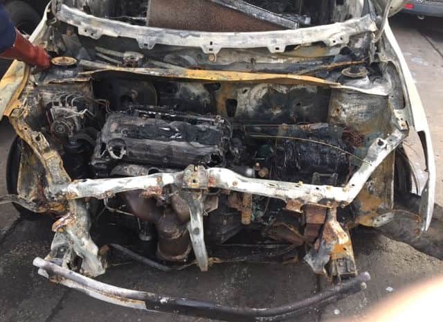 Jodie Buckley's Suzuki Swift after the fire. The mum's car suddenly caught fire while she was driving. Photo by Jo Buckley / SWNS.