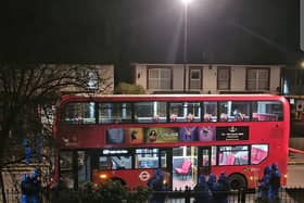 A man was tasered after allegedly threatening bus passengers with an unknown substance in Brixton, London