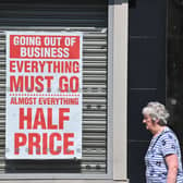 A pedestrian walks past a shuttered jewellery store with a closing down sale poster in the window in Chesterin August 2020 (Photo: PAUL ELLIS/AFP via Getty Images)