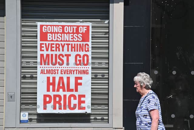 A pedestrian walks past a shuttered jewellery store with a closing down sale poster in the window in Chesterin August 2020 (Photo: PAUL ELLIS/AFP via Getty Images)