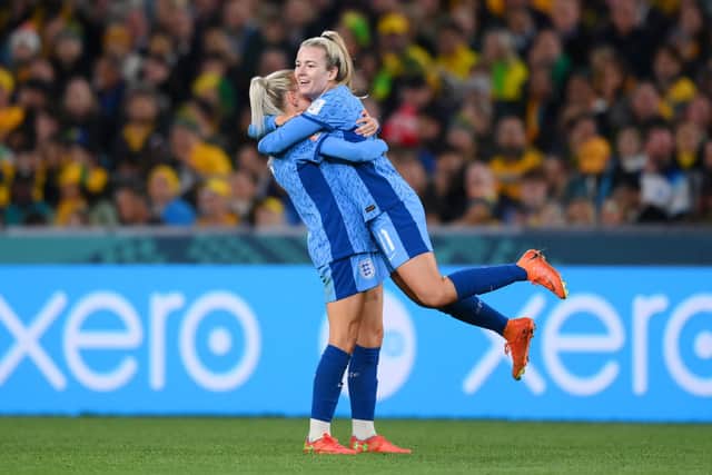 Lauren Hemp celebrates with Alex Greenwood after scoring in the World Cup semi-final against Australia