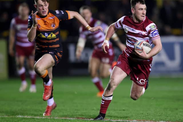 MARCH 03: Harry Smith of Wigan Warriors makes a break during the Betfred Super League between Castleford Tigers and Wigan Warriors at Mend-A-Hose Jungle on March 03, 2023 in Castleford, England. (Photo by George Wood/Getty Images)