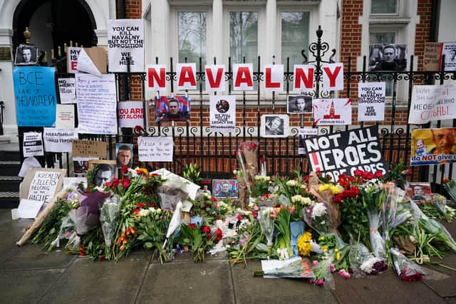 Floral tributes outside the Russian Embassy in London for jailed Russian opposition leader Alexei Navalny who died on Friday Picture: Jordan Pettitt/PA Wire 
