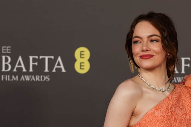 US actress Emma Stone poses on the red carpet upon arrival at the BAFTA British Academy Film Awards at the Royal Festival Hall, Southbank Centre, in London, on February 18, 2024. (Photo by Adrian DENNIS / AFP)