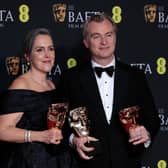  Emma Thomas and Christopher Nolan pose with the Best Film Award for 'Oppenheimer' in the Winners Room during the EE BAFTA Film Awards 2024 at The Royal Festival Hall on February 18, 2024 in London, England. (Photo by John Phillips/Getty Images)