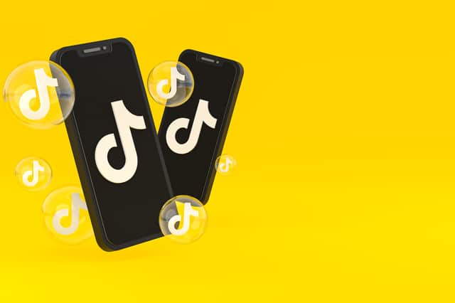 TikTok nudge feature explained, plus three simple steps to turn it on and off. Stock image by Adobe Photos.